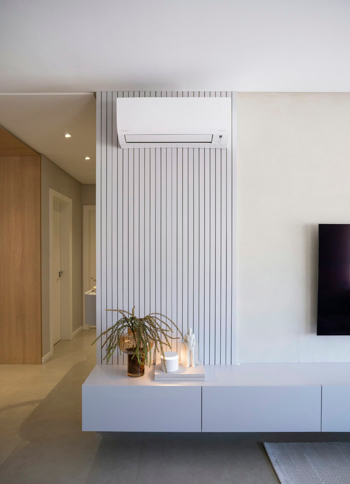 Modern living space with a wall-mounted aircon unit
