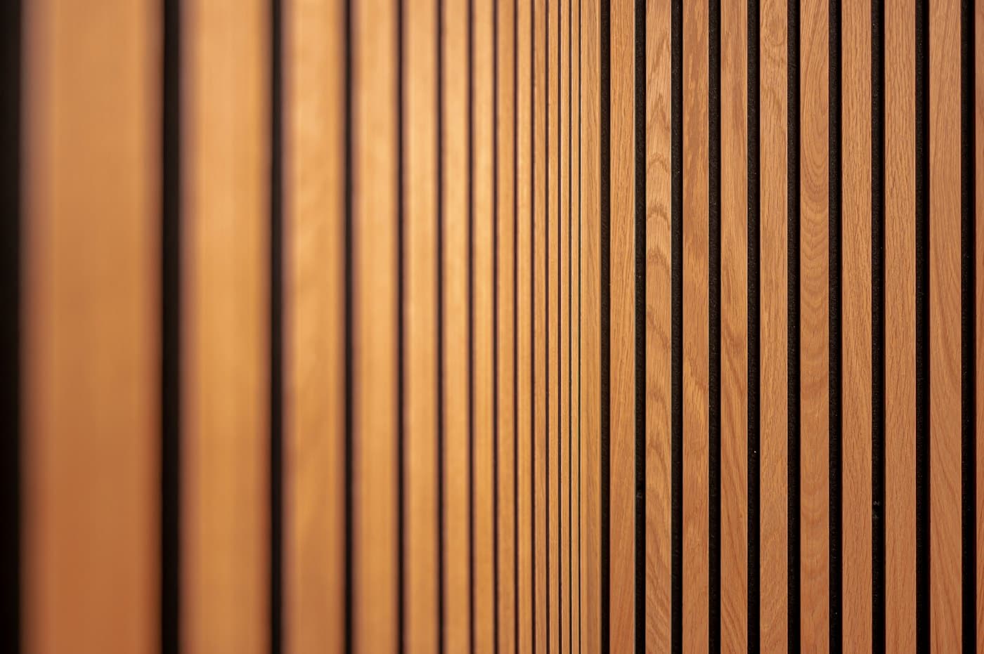 Close-up of warm wooden fluted wall slats