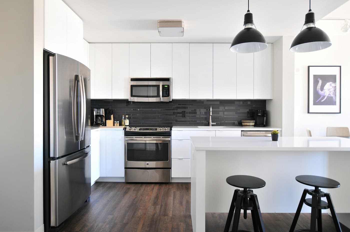 Renovated modern kitchen with white cabinets and island